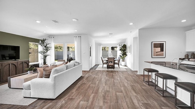 2707 Misty Elm Ln, Rosenberg, TX 77469 - living area featuring dark wood-style flooring, recessed lighting, and baseboards