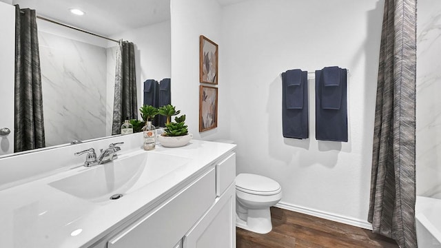 2707 Misty Elm Ln, Rosenberg, TX 77469 - full bathroom featuring wood finished floors, toilet, baseboards, a shower with curtain, and vanity