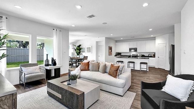 2707 Misty Elm Ln, Rosenberg, TX 77469 - living area with recessed lighting and dark wood-style flooring