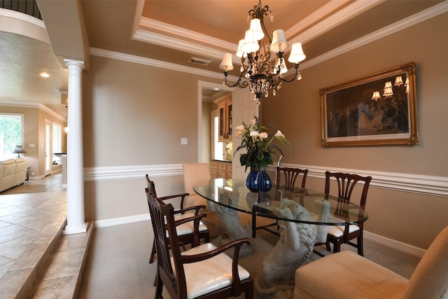7414 Regency Pl, Spring, TX 77379 - dining room featuring visible vents, a raised ceiling, baseboards, ornamental molding, and ornate columns