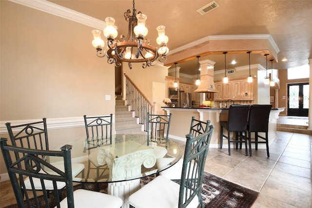 dining space featuring light tile patterned floors, visible vents, ornamental molding, and an inviting chandelier