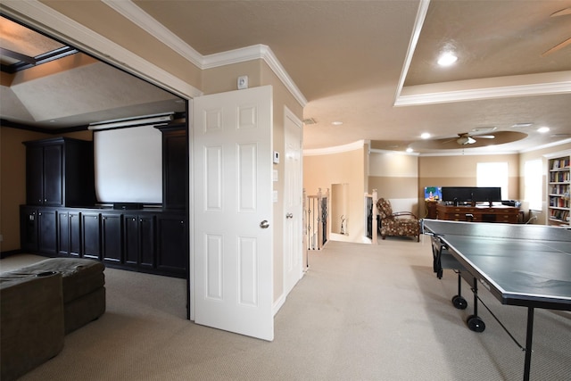 recreation room with a ceiling fan, recessed lighting, ornamental molding, and light carpet