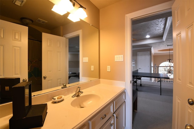 7414 Regency Pl, Spring, TX 77379 - full bath with crown molding, a tray ceiling, visible vents, and vanity