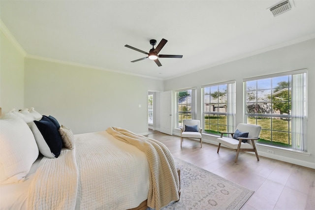 bedroom featuring visible vents, baseboards, and multiple windows