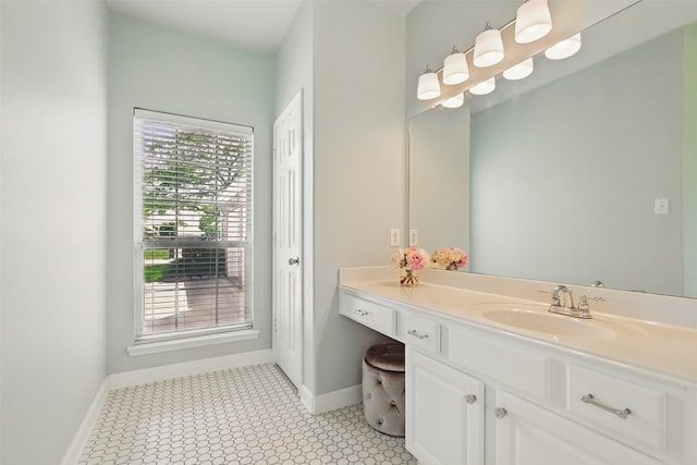 bathroom featuring baseboards, vanity, and tile patterned floors