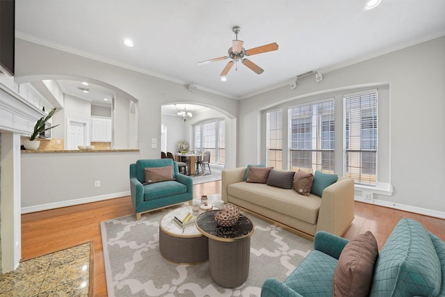 13611 Brookbluff Ln, Houston, TX 77077 - living room with baseboards, a ceiling fan, wood finished floors, and arched walkways