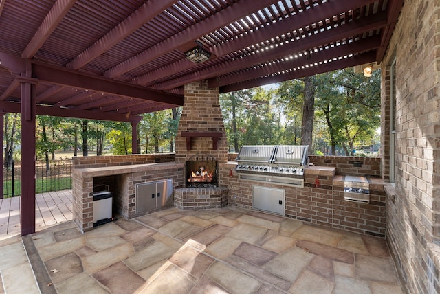 1614 Beau Rivage, Conroe, TX 77304 - view of patio / terrace with a grill, an outdoor kitchen, fence, and a pergola