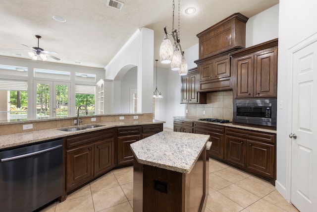 1614 Beau Rivage, Conroe, TX 77304 - kitchen with stainless steel appliances, a sink, a ceiling fan, decorative backsplash, and recessed lighting