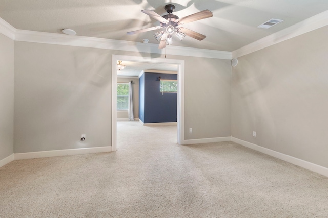 1614 Beau Rivage, Conroe, TX 77304 - empty room with crown molding, a ceiling fan, carpet floors, and baseboards