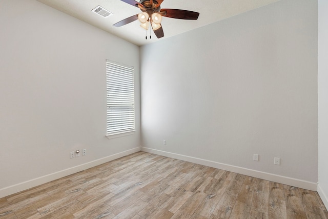 1614 Beau Rivage, Conroe, TX 77304 - unfurnished room featuring a ceiling fan, baseboards, light wood-type flooring, and plenty of natural light