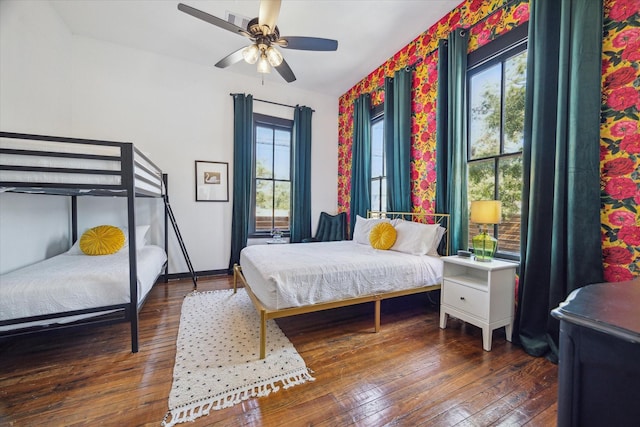 1920 Fulton St, Houston, TX 77009 - bedroom featuring multiple windows, hardwood / wood-style flooring, and a ceiling fan