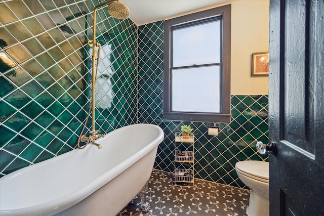 1920 Fulton St, Houston, TX 77009 - full bathroom with tile walls, a freestanding tub, toilet, tiled shower, and wainscoting