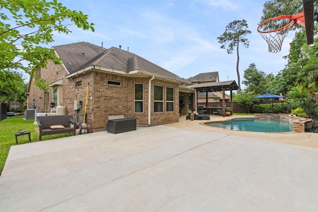 view of swimming pool with a patio, central AC, a fenced in pool, and a fenced backyard