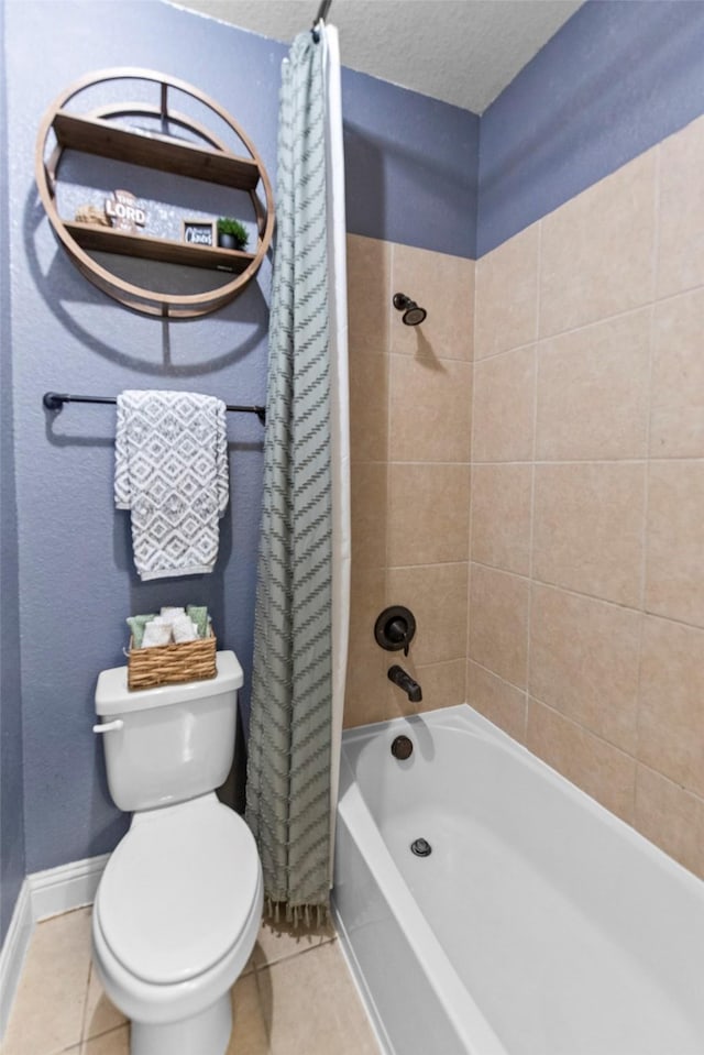full bath with a textured ceiling, shower / bath combination with curtain, tile patterned floors, baseboards, and toilet