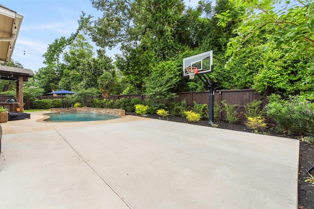 exterior space featuring a fenced in pool and a fenced backyard