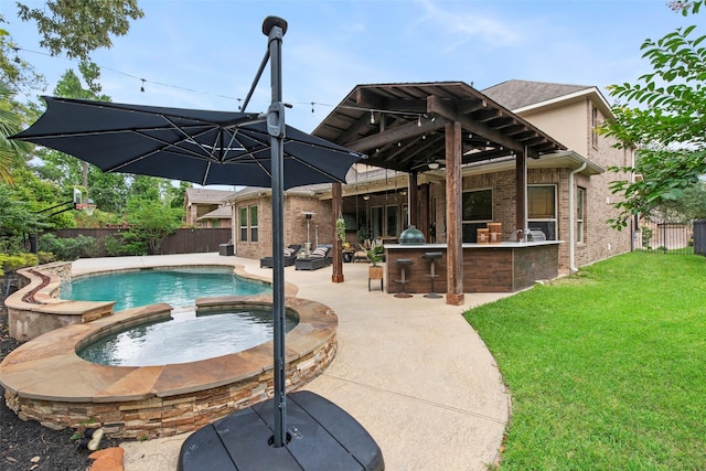 view of pool with a fenced backyard, outdoor dry bar, a fenced in pool, a lawn, and an in ground hot tub