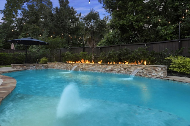 view of swimming pool featuring a fenced in pool and a fenced backyard