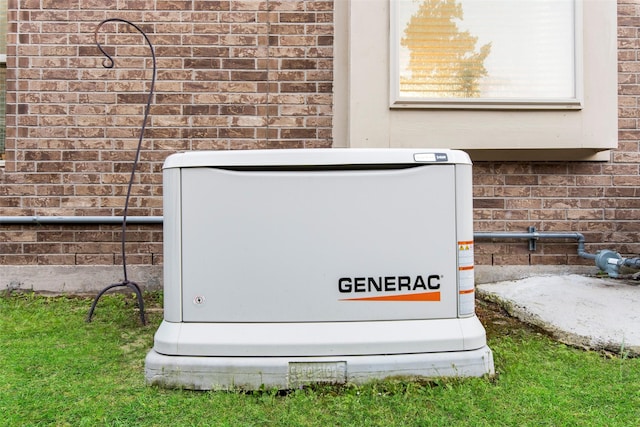 exterior details with a power unit and brick siding