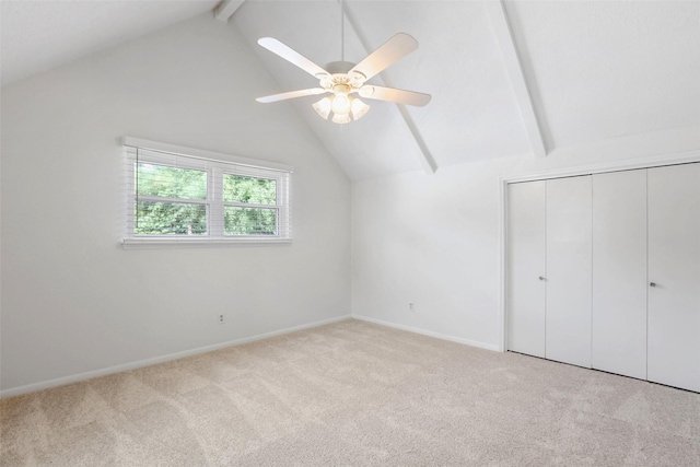 bonus room with lofted ceiling with beams, baseboards, a ceiling fan, and carpet flooring