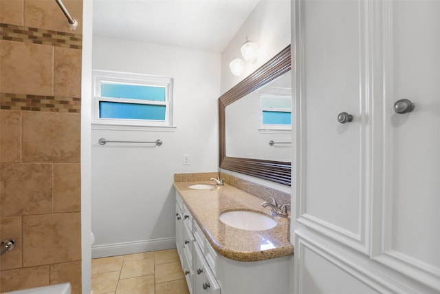 full bathroom featuring  shower combination, tile patterned floors, a sink, and double vanity