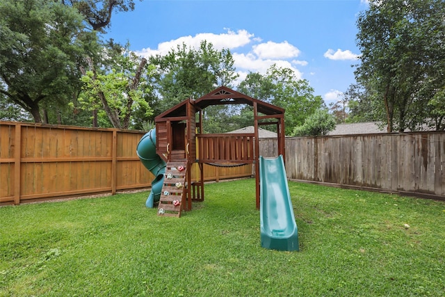 view of jungle gym featuring a fenced backyard and a yard