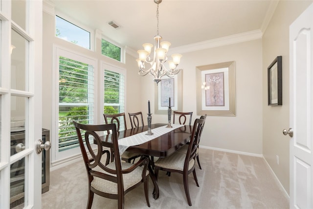 dining area featuring visible vents, a healthy amount of sunlight, light carpet, baseboards, and a chandelier