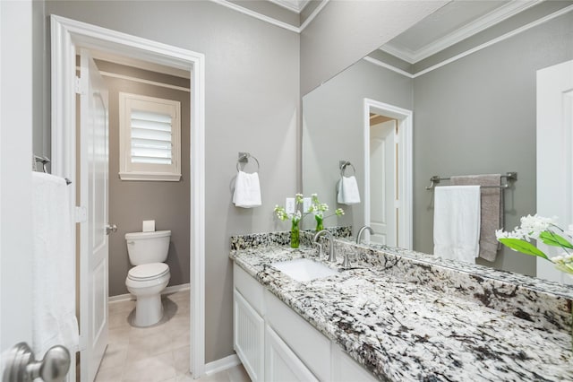 bathroom featuring toilet, baseboards, tile patterned flooring, vanity, and ornamental molding