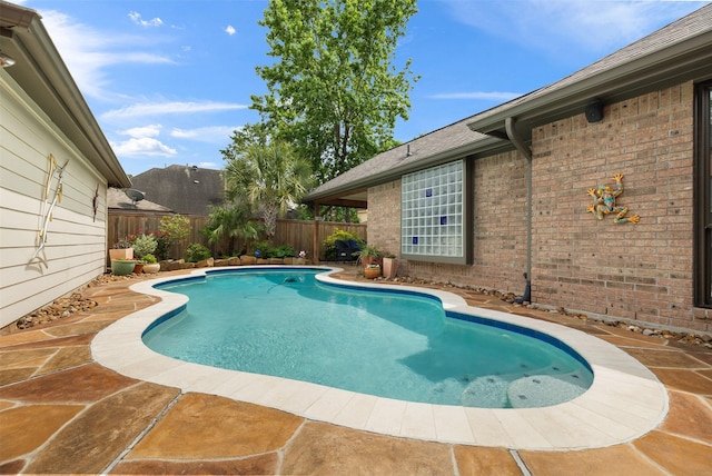 view of swimming pool with a fenced in pool and a fenced backyard