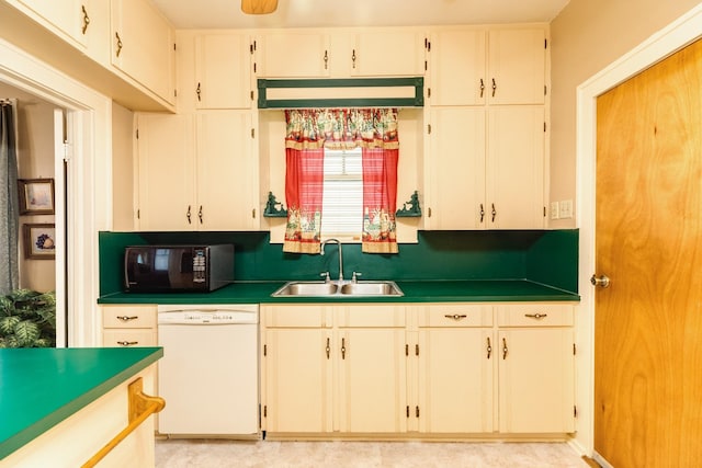 kitchen featuring white cabinets, dark countertops, dishwasher, a sink, and black microwave