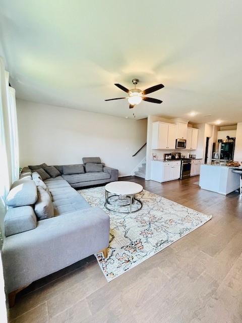 27915 Western Creek Ct, Katy, TX 77494 - living area featuring a ceiling fan and stairs