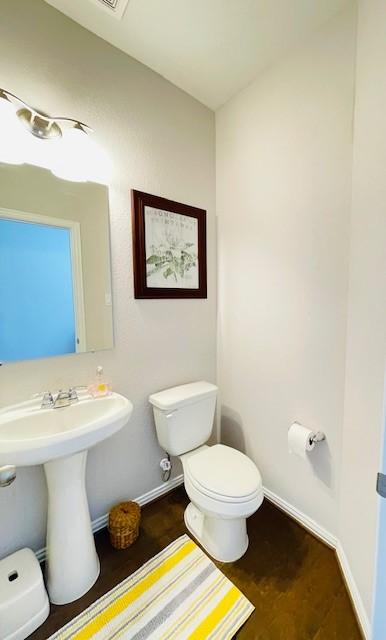 27915 Western Creek Ct, Katy, TX 77494 - half bath featuring toilet, a sink, and baseboards