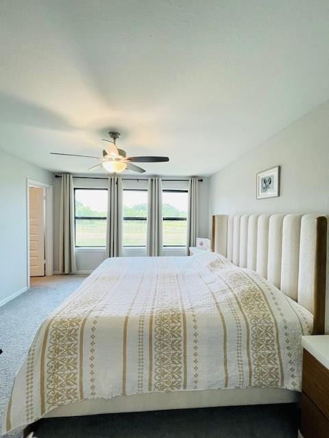 27915 Western Creek Ct, Katy, TX 77494 - carpeted bedroom with baseboards and ceiling fan