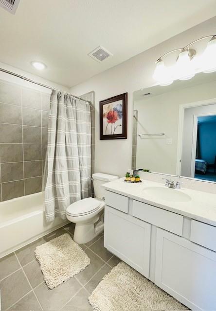 27915 Western Creek Ct, Katy, TX 77494 - bathroom with tile patterned floors, visible vents, vanity, and toilet