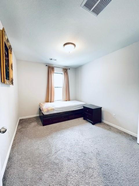 27915 Western Creek Ct, Katy, TX 77494 - carpeted bedroom featuring baseboards and visible vents