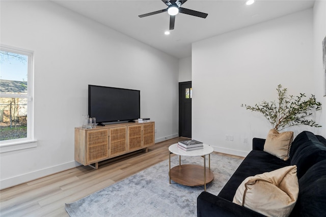 living room with ceiling fan, a healthy amount of sunlight, wood finished floors, and recessed lighting