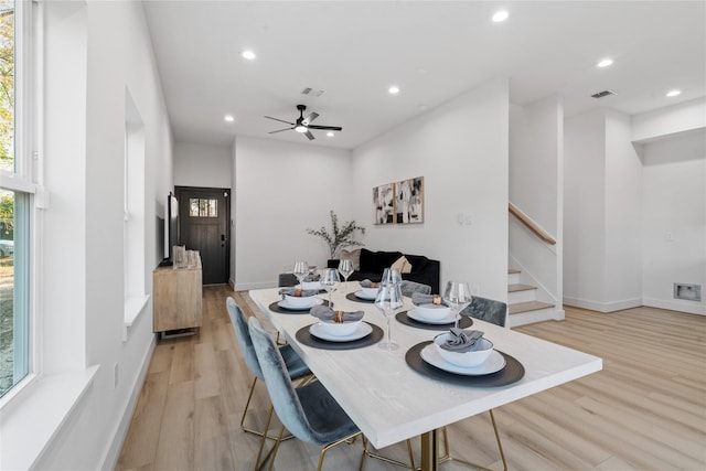 dining room with light wood-style floors, visible vents, and recessed lighting