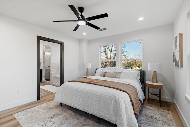 bedroom featuring baseboards, wood finished floors, visible vents, and recessed lighting