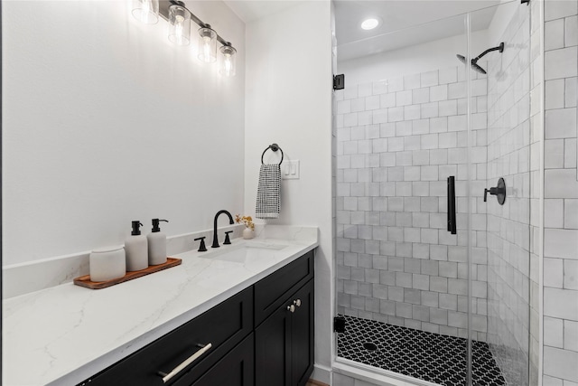 bathroom featuring a shower stall, vanity, and recessed lighting
