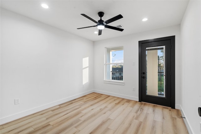 interior space with ceiling fan, wood finished floors, visible vents, and recessed lighting