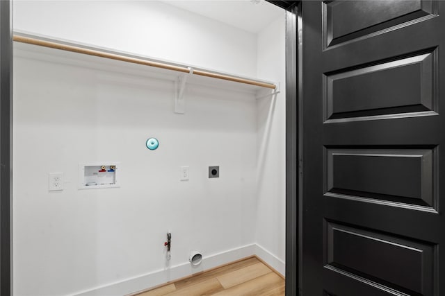 washroom with light wood-style floors, hookup for a gas dryer, baseboards, laundry area, and washer hookup