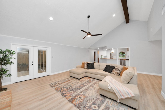 living room with ceiling fan, beamed ceiling, french doors, and wood finished floors