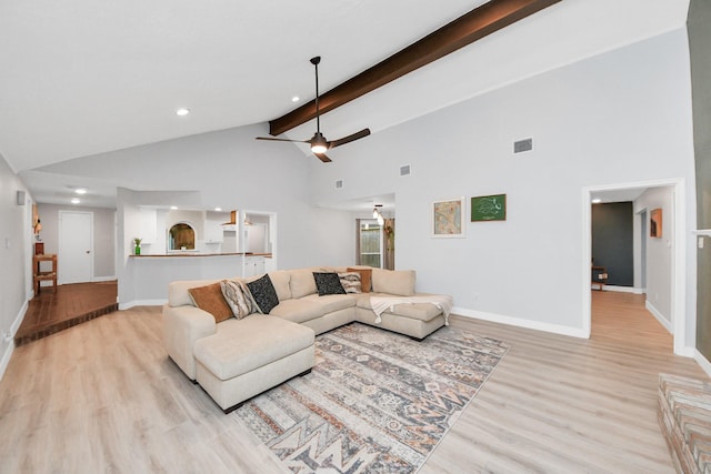 living room with light wood-style floors, beamed ceiling, a ceiling fan, and recessed lighting