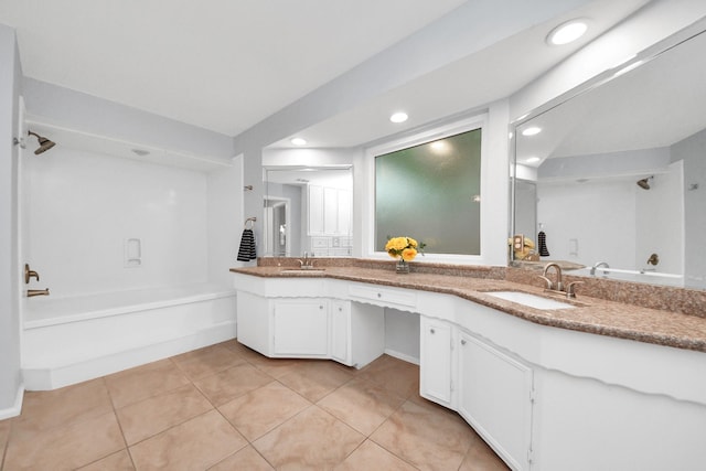 full bath featuring a sink, tile patterned floors, recessed lighting, and a bath