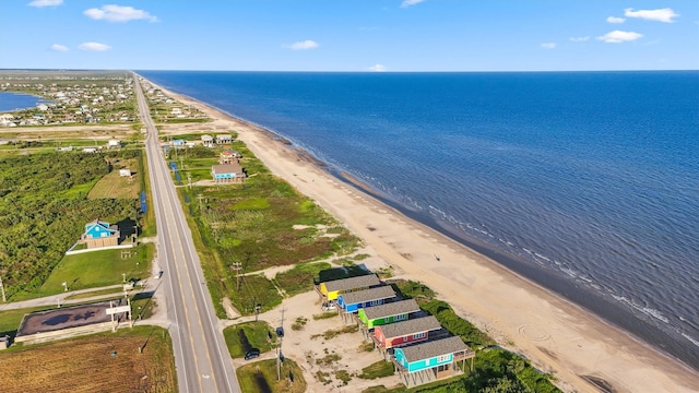 bird's eye view with a beach view and a water view