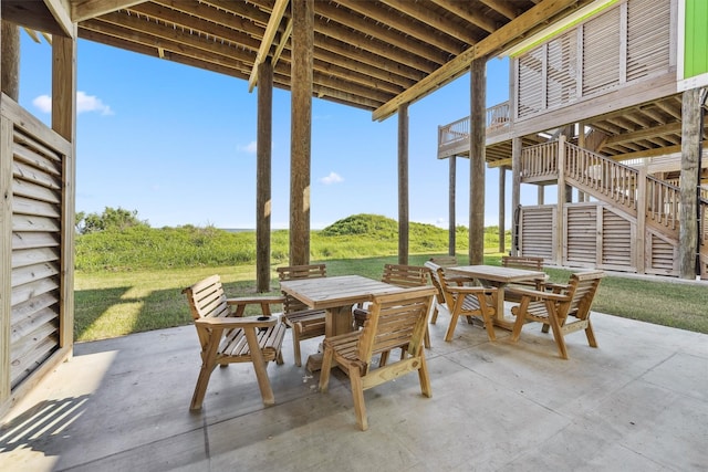 view of patio / terrace with stairway and outdoor dining area