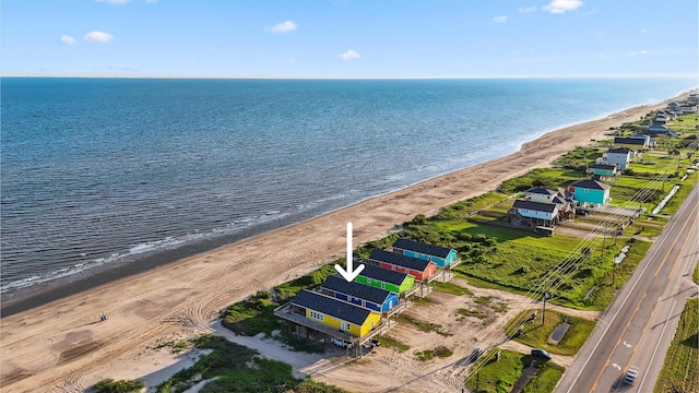 aerial view featuring a view of the beach and a water view