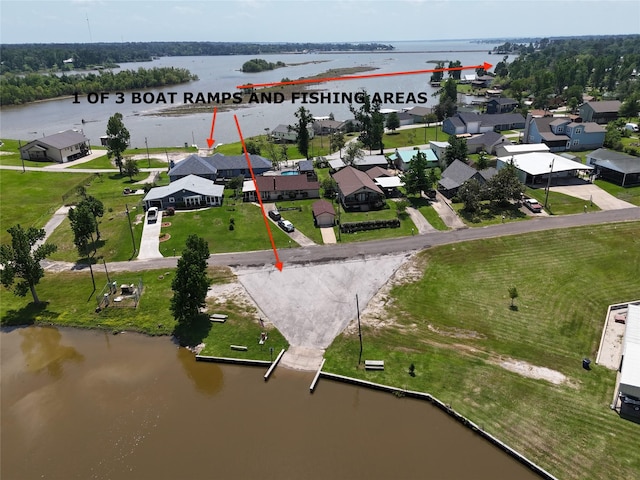 bird's eye view with a residential view and a water view