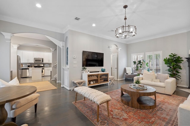 living room with ornate columns, visible vents, and recessed lighting