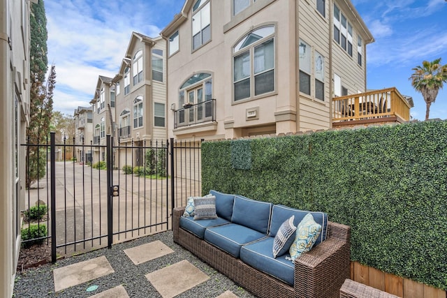 view of patio with a fenced backyard, a gate, and an outdoor living space