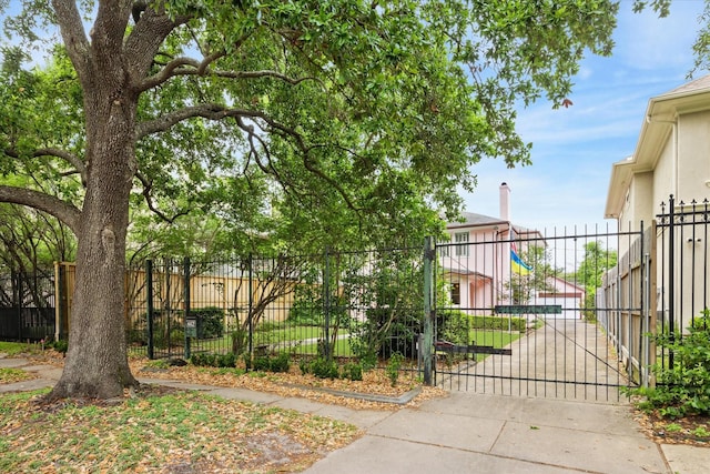 view of gate with fence